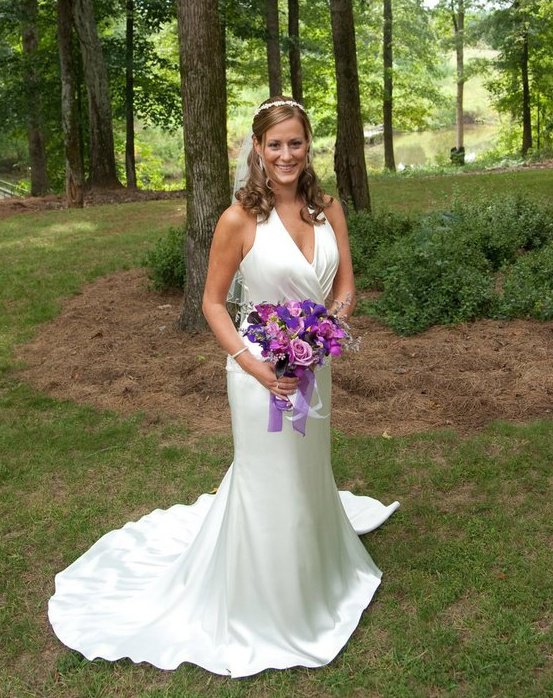 bride holding purple bridal bouquet