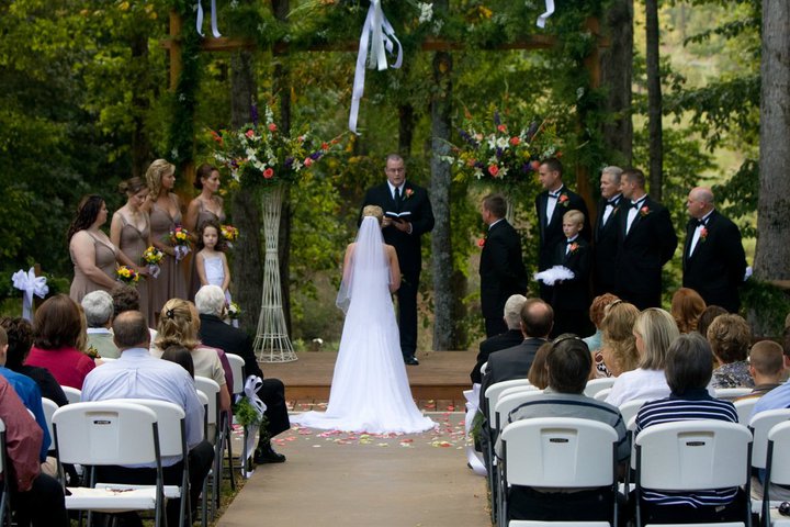 couple saying vows in outdoor wedding ceremony